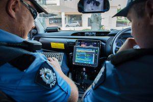 Two officers in a police car